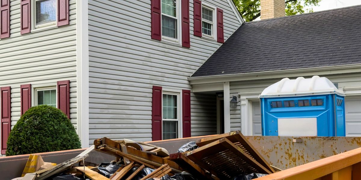 Property cleanout crew clearing furniture and debris from a house in NYC or Long Island